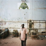 Soumaila (43), who works for the local football club, in an old warehouse used to prepare food.