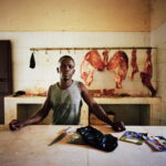 A butcher at his stall inside the central market.